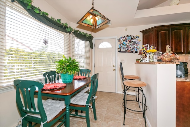 dining space with light tile patterned floors