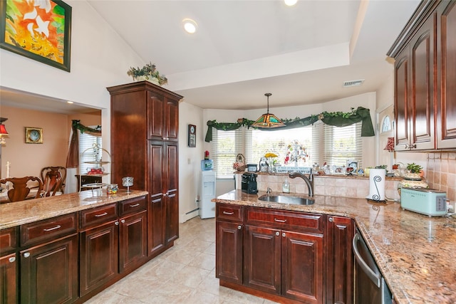 kitchen featuring a peninsula, a sink, visible vents, stainless steel dishwasher, and decorative backsplash