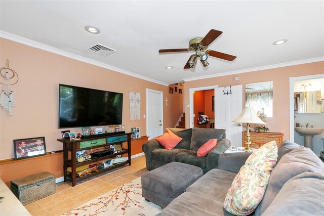 living room featuring ornamental molding, visible vents, stairway, and tile patterned floors