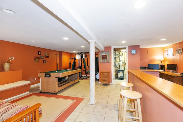 recreation room with recessed lighting, baseboards, light tile patterned flooring, and a bar