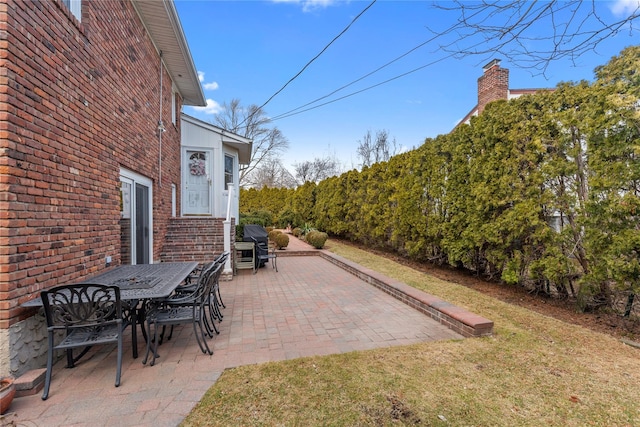 view of patio / terrace featuring a grill and outdoor dining area