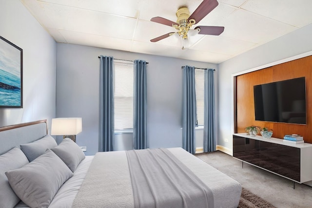 bedroom with light colored carpet and ceiling fan