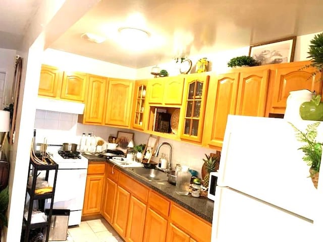 kitchen featuring white appliances and sink