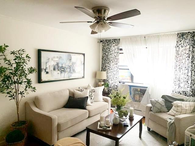 living room featuring ceiling fan