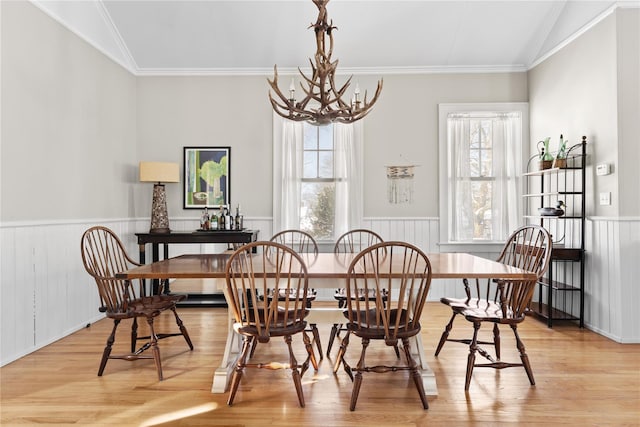 dining space with a chandelier, light wood-type flooring, and a wealth of natural light