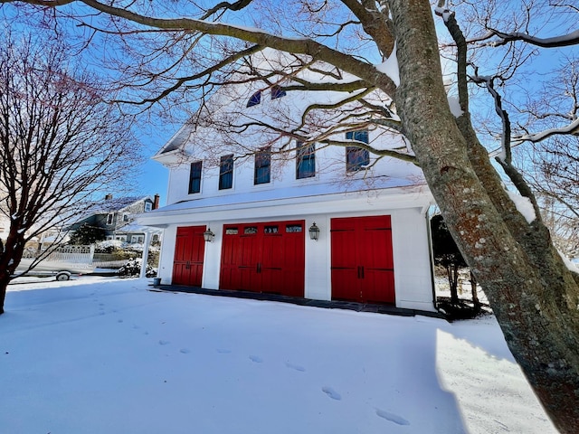 view of snow covered garage