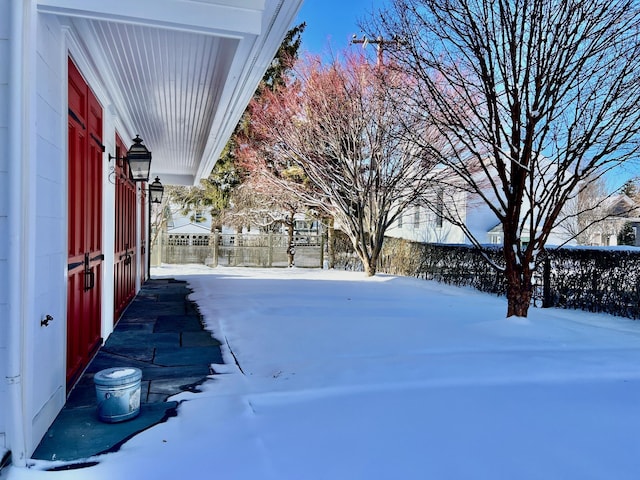 view of yard layered in snow