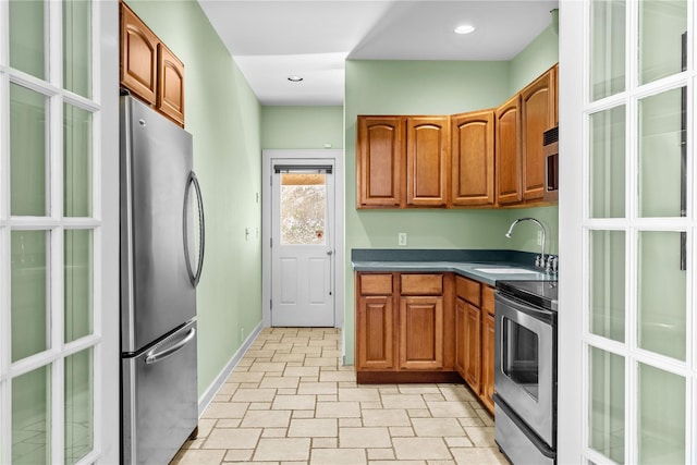 kitchen featuring appliances with stainless steel finishes and sink