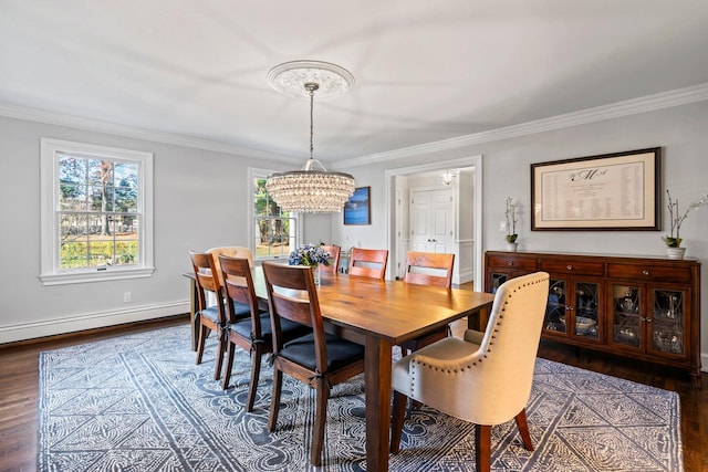 dining area with a chandelier, baseboards, baseboard heating, dark wood-style floors, and crown molding