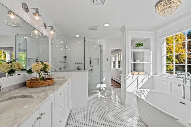 bathroom with ornamental molding, visible vents, a sink, and a shower stall