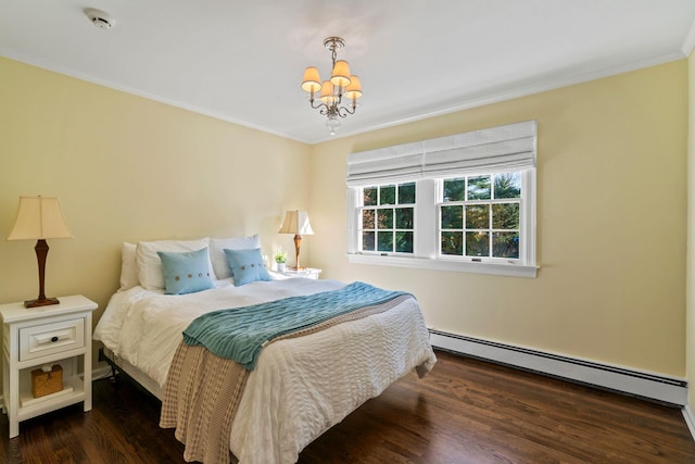 bedroom featuring dark wood-type flooring, ornamental molding, baseboard heating, and an inviting chandelier