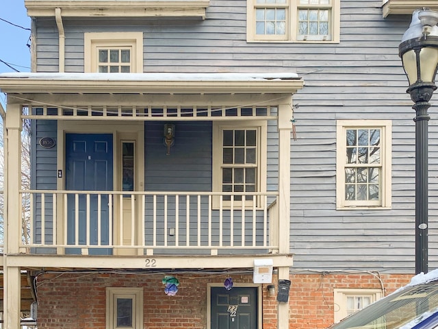 property entrance with a balcony