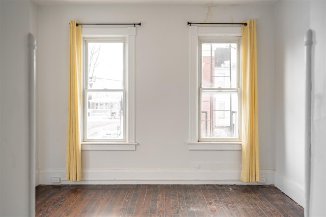 unfurnished room with dark hardwood / wood-style floors