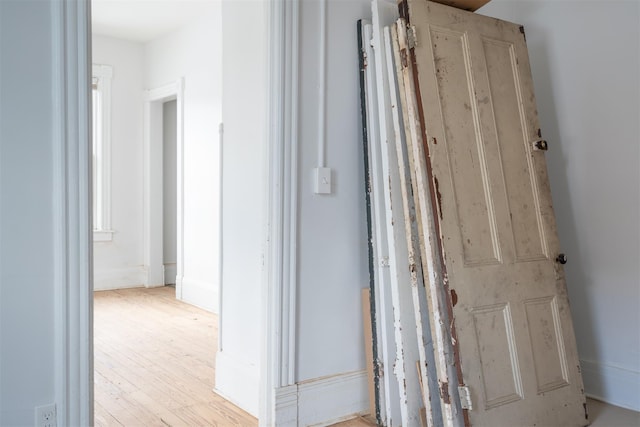 hallway with light wood-type flooring