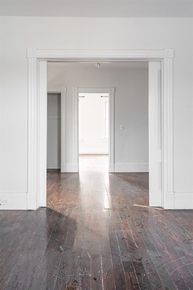 unfurnished room featuring dark hardwood / wood-style flooring