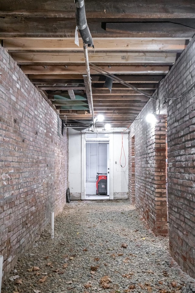 basement with brick wall