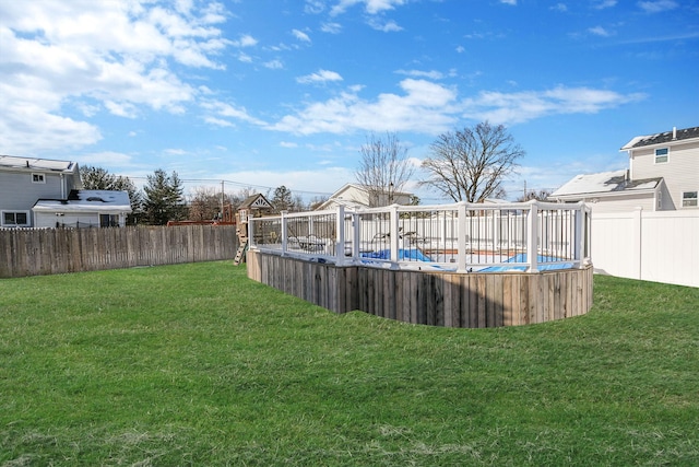 view of yard with a covered pool