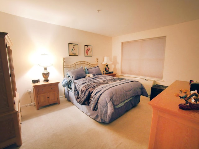 bedroom featuring light colored carpet