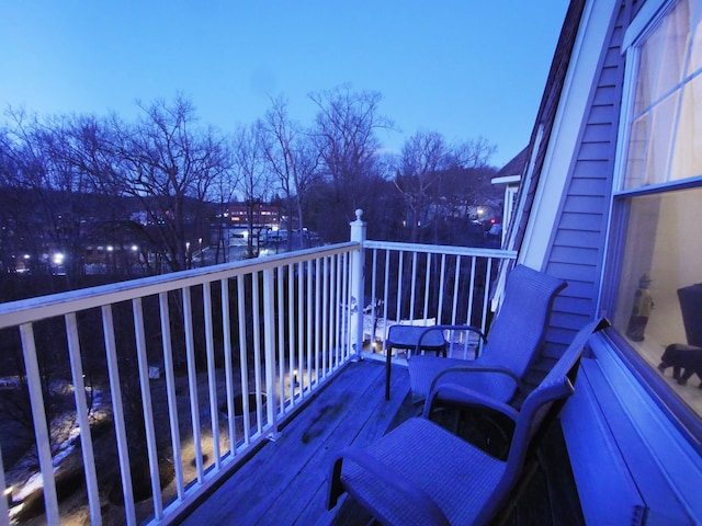 view of balcony at dusk