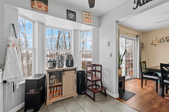 interior space with ceiling fan and light hardwood / wood-style floors