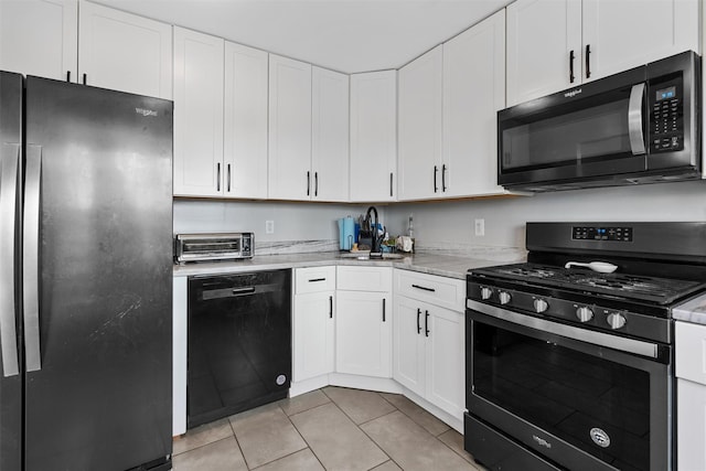 kitchen featuring white cabinetry, stainless steel gas range oven, fridge, and dishwasher