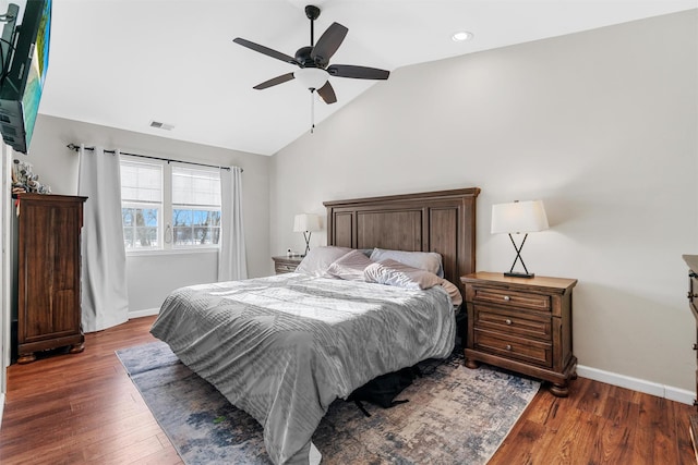 bedroom featuring lofted ceiling, dark wood-type flooring, and ceiling fan