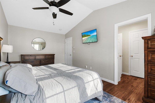 bedroom featuring vaulted ceiling, dark wood-type flooring, and ceiling fan