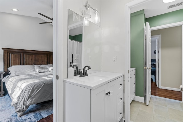 bathroom with vanity and ceiling fan