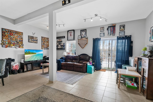 tiled living room with rail lighting