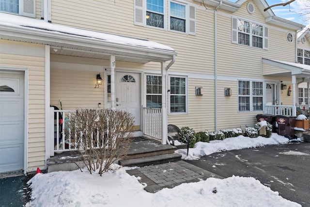 view of snow covered property entrance