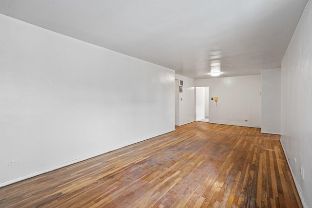 unfurnished room featuring hardwood / wood-style flooring