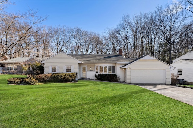 ranch-style house featuring a garage and a front lawn