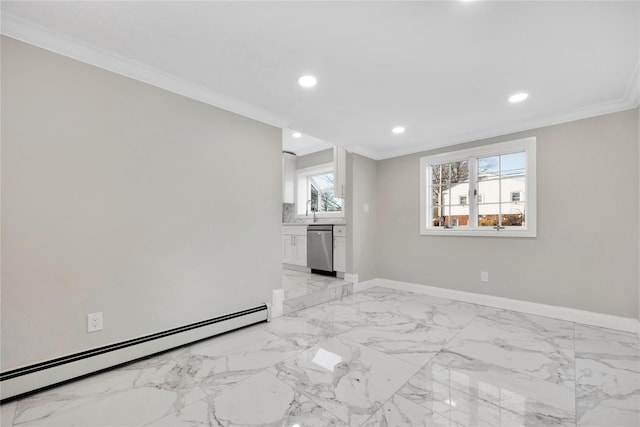 empty room featuring a baseboard heating unit, ornamental molding, and sink