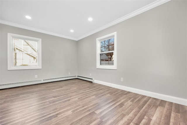 unfurnished room with ornamental molding, light hardwood / wood-style floors, and baseboard heating