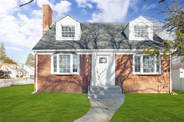 cape cod-style house featuring a front lawn