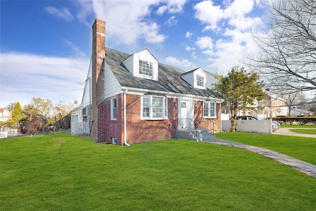 cape cod-style house featuring a front lawn