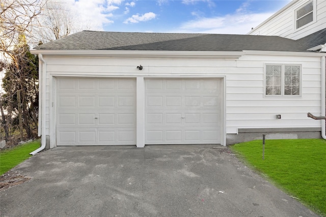 garage with a lawn