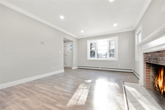 unfurnished living room featuring baseboard heating, crown molding, light hardwood / wood-style flooring, and a fireplace