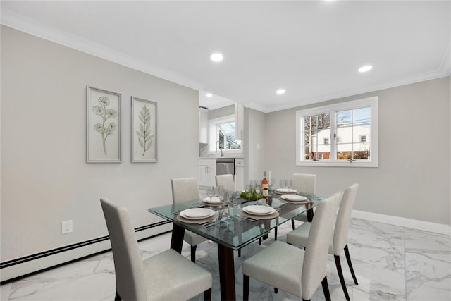 dining area with sink, crown molding, and a baseboard radiator