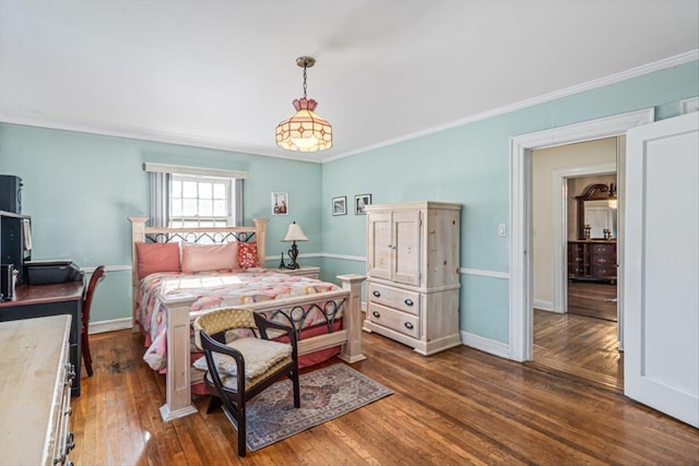 bedroom with dark wood-style floors, baseboards, and ornamental molding