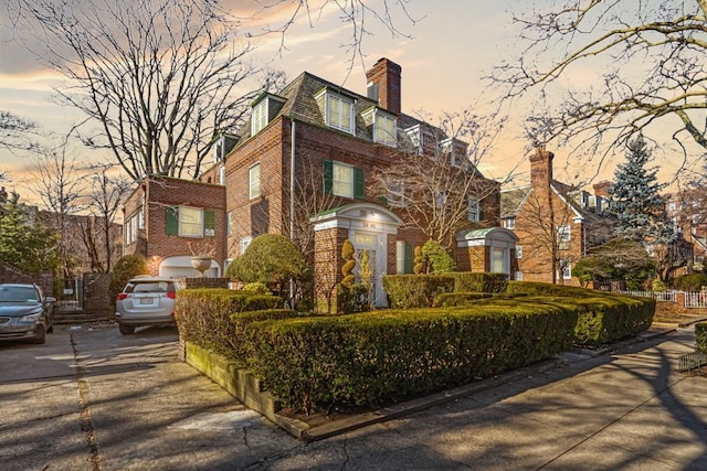 34-42 87th St, Jackson Heights, NY 11372 - view of front of property featuring brick siding and a chimney