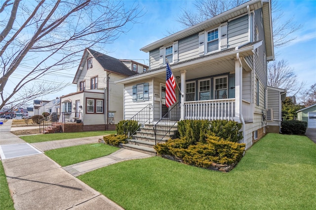 traditional style home featuring a porch and a front yard