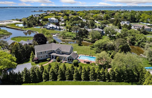 birds eye view of property with a water view