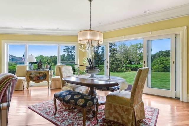 sunroom featuring a notable chandelier
