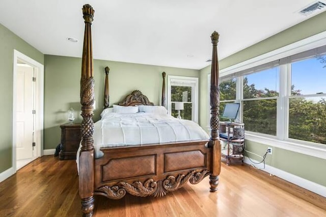 bedroom with hardwood / wood-style floors