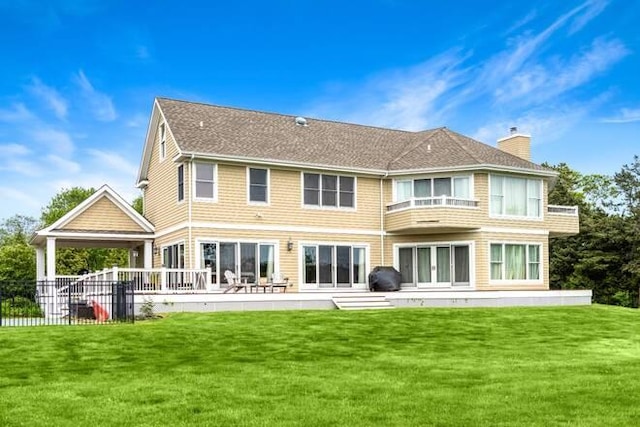 back of property with a yard