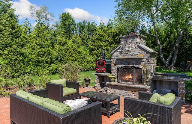 view of patio / terrace featuring an outdoor living space with a fireplace