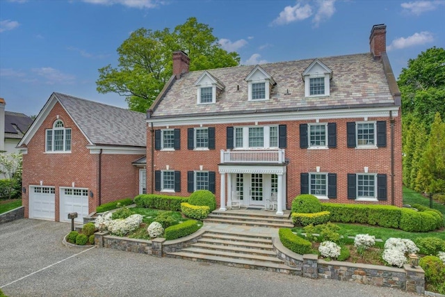 colonial home with a garage