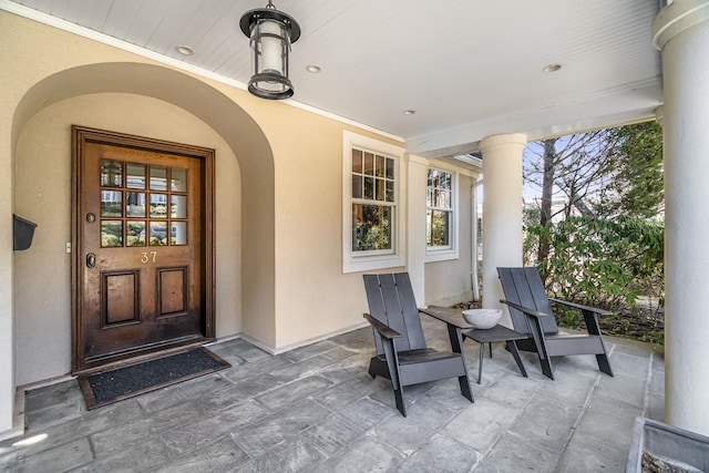 view of exterior entry featuring stucco siding