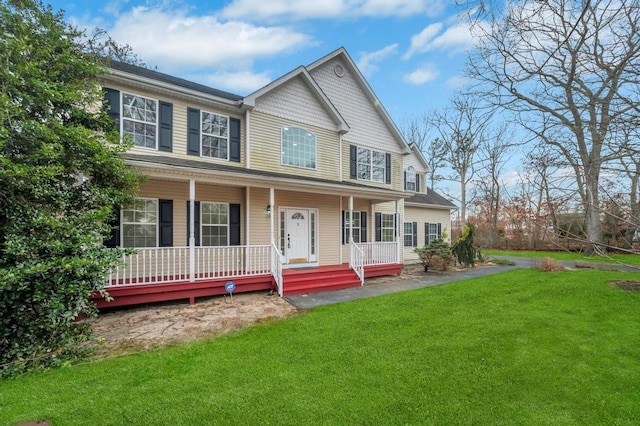 view of front of property featuring covered porch and a front lawn